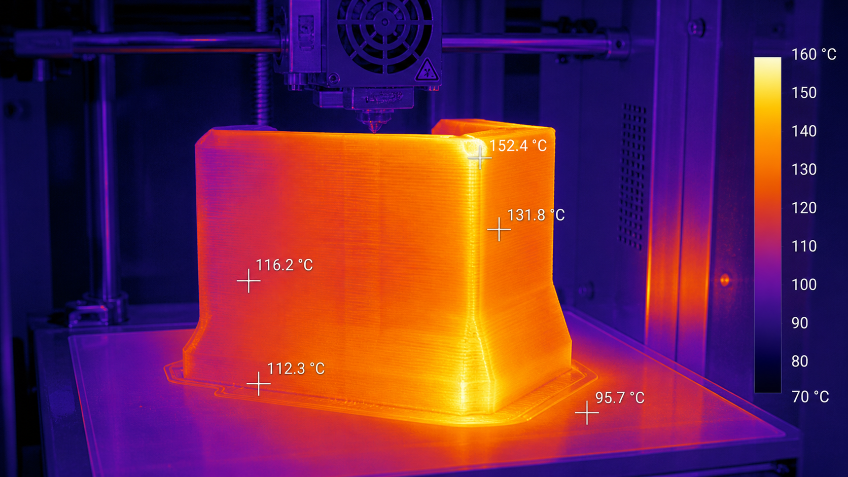 A thermal camera image displaying heat gradients across a PEEK part during the 3D printing process.